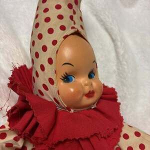 Vintage Hand Made Fancy Clown Doll with Rubber Face and red claw hands.